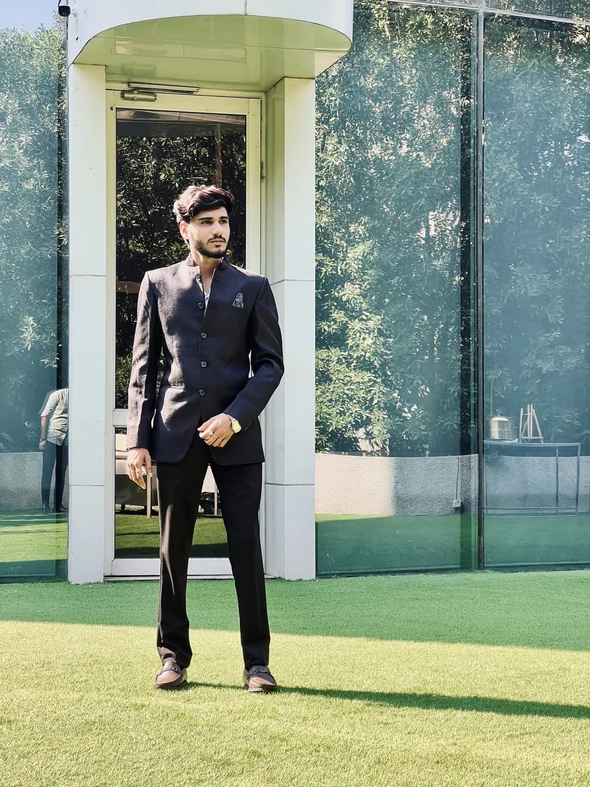 The astrologer of AstroVishalJoshi standing in a dark bandhgala suit